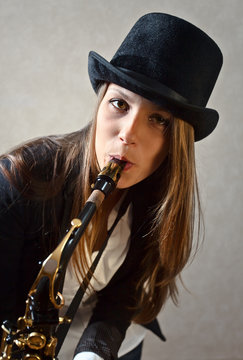 young beautiful woman with saxophone