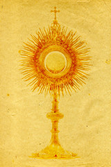 liturgical vessel gold monstrance on grunge paper background
