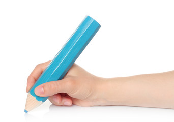 Woman hand with big blue wooden pencil on a white background .