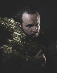 Love, man beard and suit made with golden wings