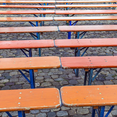 hinged benches made of wood at the floor