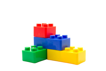 Plastic building blocks on white background