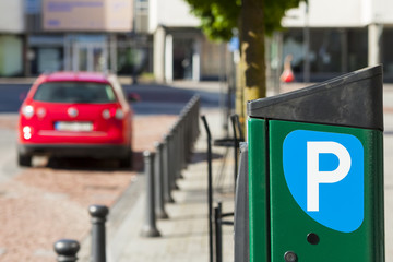 Paid parking for cars in city. Parking fees.
