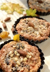 Small tarts in metal shapes, shells filled with nuts .