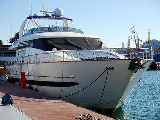 Fototapeta premium Yacht. A luxury yacht at the yacht club in the port