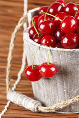 Fresh cherries in a wood bucket