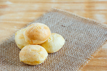 Brazilian snack cheese bread (pao de queijo) on sackcloth