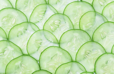 Cucumber and slices on  background.