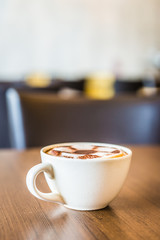 Coffee cup in coffee shop interior