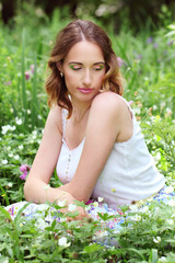 Girl in flowerbed