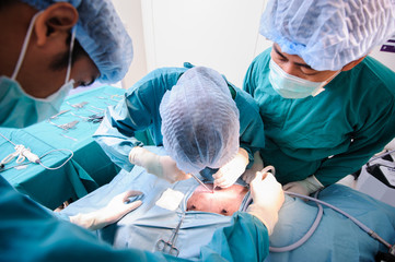 veterinarian surgeons in operation room