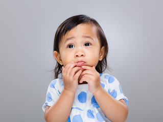 Baby girl with funny face expression