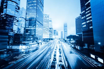 Fotobehang traffic with blur light through city at night © snvv