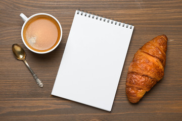 espresso, croissant and notepads, photo concept, top view