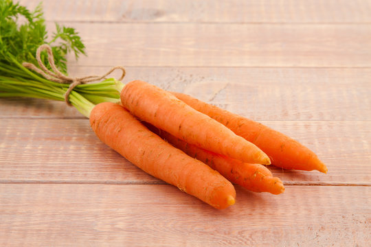 Fresh organic carrots with their tops