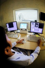 veterinarian doctor working in CT scanner computer control