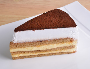 Tiramisu cake on white plate