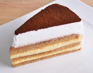 Tiramisu cake on white plate