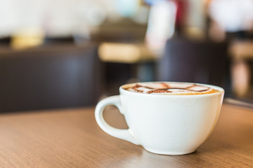 Coffee cup in coffee shop interior