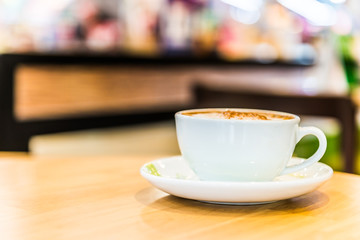 Coffee cup in coffee shop interior