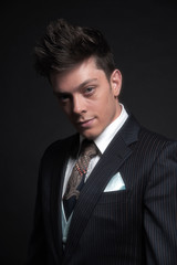 Casual stylish young business man wearing dark blue striped jack