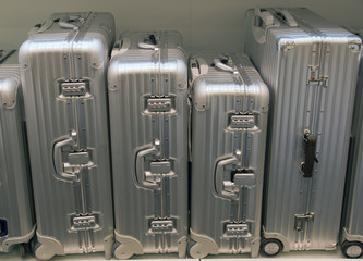 Silver suitcases of different size
