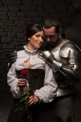 Knight giving a rose to lady