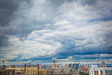 Naklejka premium construction of a new district and a blue sky with clouds