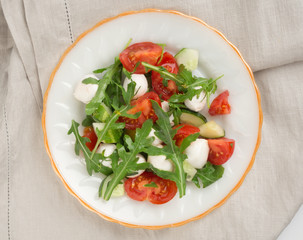 salad from arugula tomato and mozzarella