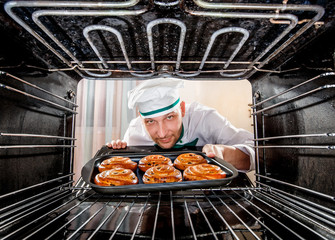 Chef cooking in the oven.