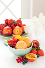 Peach sorbet and fresh berries, selective focus