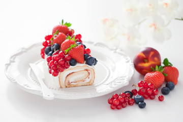 Cake roll with fresh berries, selective focus