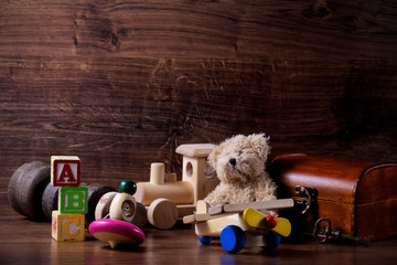 collection of old wood children toys with teddy bear - obrazy, fototapety, plakaty