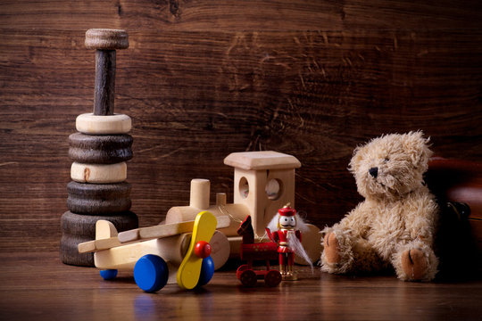 collection of old wood children toys with teddy bear