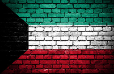 Brick wall with painted flag of Kuwait