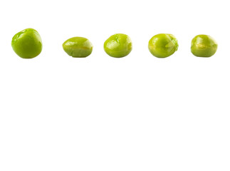 Green peas over white background