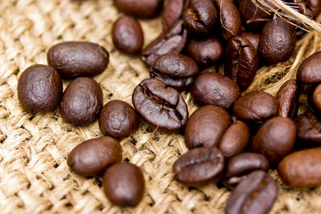 Coffee beans on vintage linen background