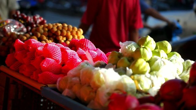 Exotic fruits for sale in the street Asian market. Video