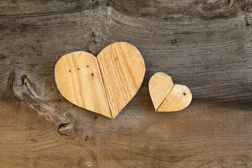 Two Love Valentines wooden hearts on old Elm background