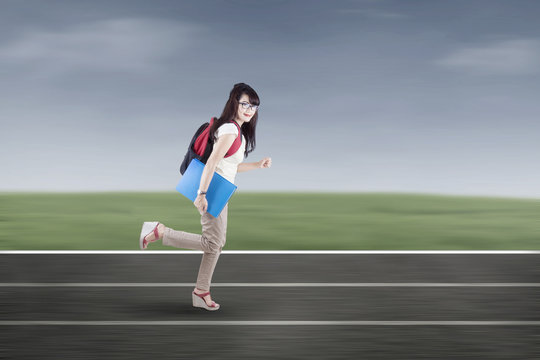 Student running on tracks