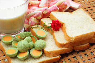 fresh milk and pink marshmallows with a slice of bread.