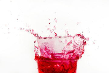 close up red cocktail splashing