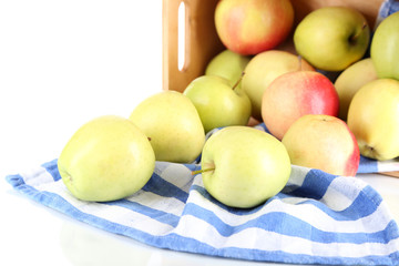 Juicy apples on napkin in box isolated on white