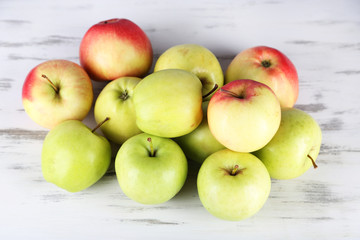 Juicy apples on wooden table