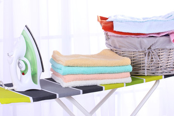 Basket with laundry and ironing board