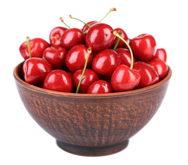 Sweet cherries in color bowl isolated on white
