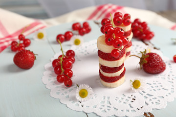 Stack of sliced fruits on table, close up