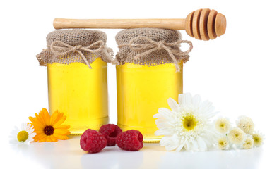 Jar full of delicious fresh honey and wild flowers, isolated
