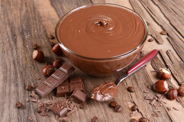 Sweet chocolate cream in bowl on table close-up
