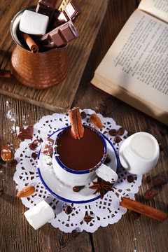 Cup of hot chocolate on table, close up